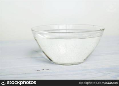 water in a bowl on a white background