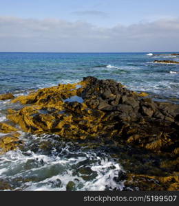 water in lanzarote isle foam rock spain landscape stone sky cloud beach