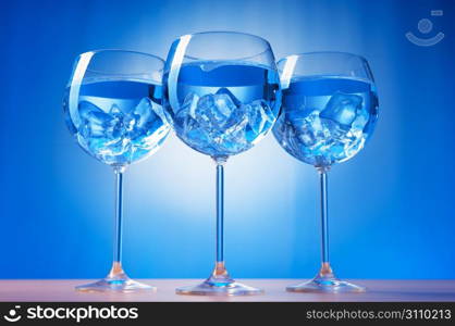 Water in the glass against gradient background