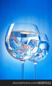 Water in the glass against gradient background