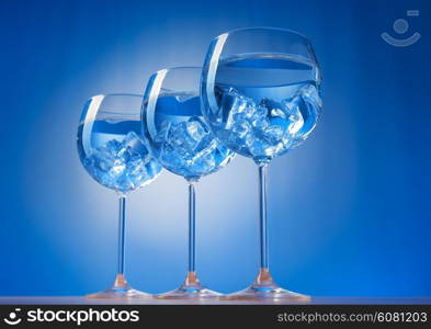 Water in the glass against gradient background