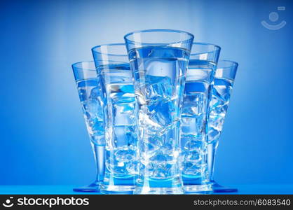 Water in the glass against gradient background