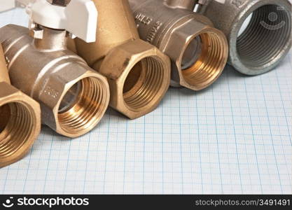 water inlet valve on a background of graph paper