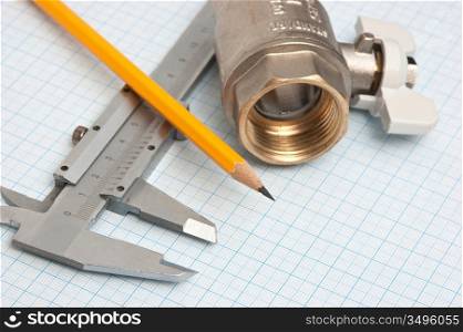 water inlet valve on a background of graph paper