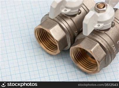 water inlet valve on a background of graph paper