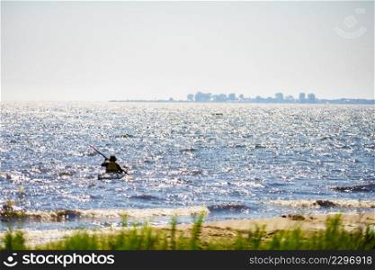 Water lake shore and person kayaking. Water shore and person kayaking