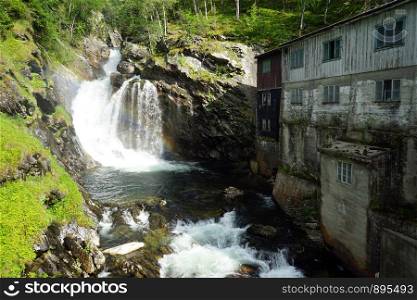 Water mill near Ulafossen waterfall in Norway