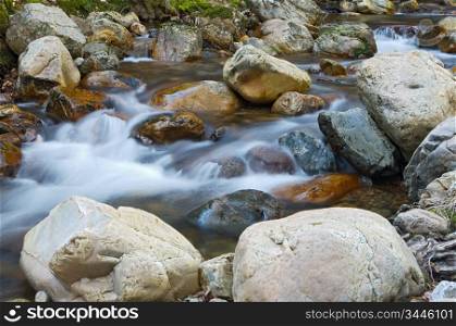 Water movement in the waterfall on stone background