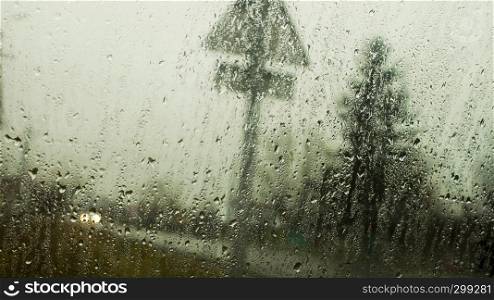 Water on glass on rain background