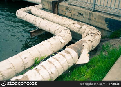Water pipes outdoors near river