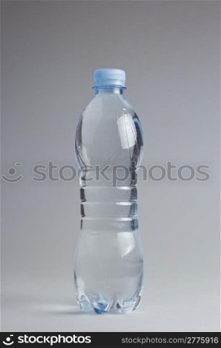 Water plastic blue bottle over white background