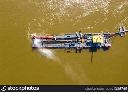 Water pump on the river bank on a big boat. Aerial view