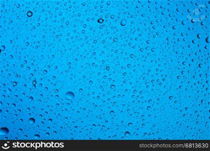 Water raindrops nano effect on a blue background