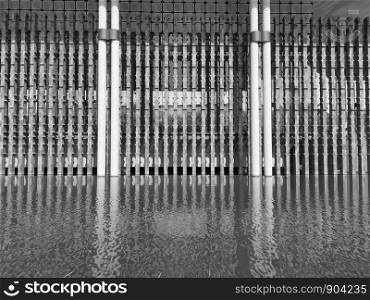 Water reflection architecture in black and white tones.