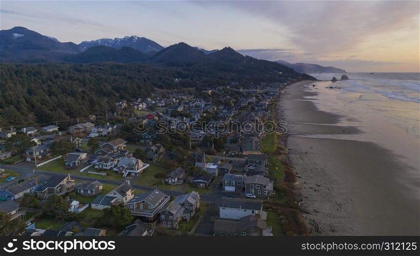 Water Rolls up onto the beach at sunset in a popular Oregon coastal town