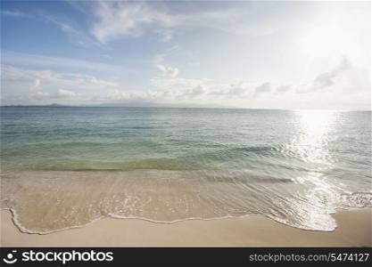 Water&rsquo;s edge on beach; Koh Pha Ngan; Thailand