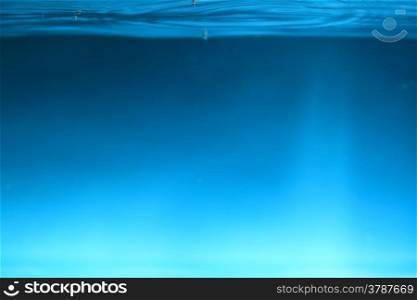 Water splash and air blue over dark background