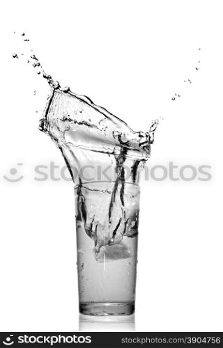 water splash in glass isolated on white