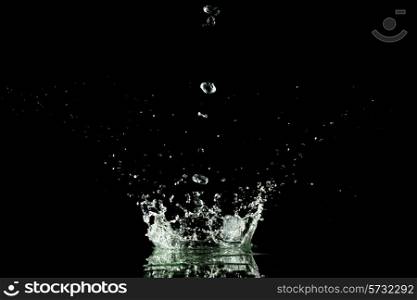 Water splash isolated on black background close-up