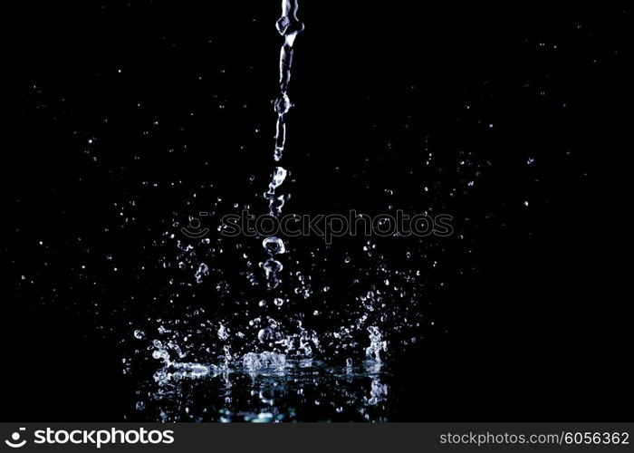 Water splash isolated on black background close-up