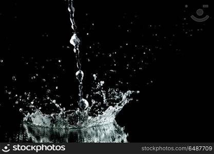 Water splash isolated on black background close-up
