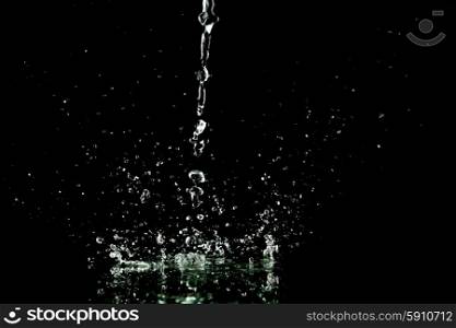 Water splash isolated on black background close-up. Water splash