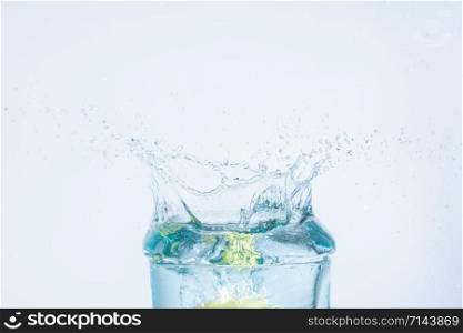 water splash of lemon in a glass