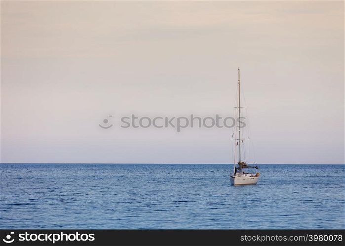 Water sports, vacation recreation and relaxation on seaside or lake. Yacht sail boat on calm sea water. Yacht sail boat on calm sea water