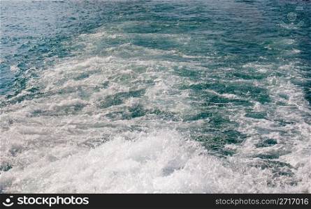 Water surf behind ferry on Lake Garda