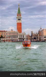Water taxi, Venice lagoon, San Marco Piazza, Saan Marco Basilica, Campanile all in one image - very typical Venice
