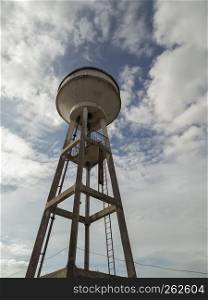 Water tower with blue sky