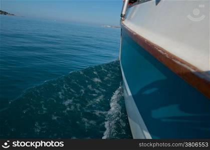 Water wake behind yacht yacht