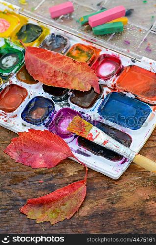 Watercolor paint,paint brush for painting and autumn leaves
