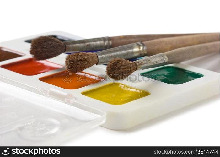 watercolor paints and art brushes