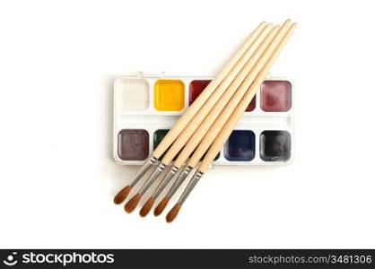 watercolor paints and brushes isolated on a white background