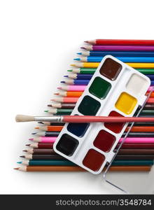 watercolor paints and colored pencils isolated on a white background