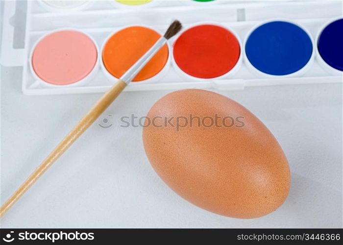 Watercolors and paintbrush for painting a Easter eggs