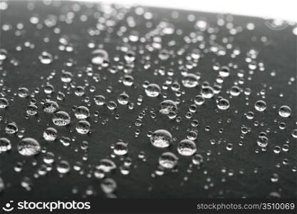 waterdrops on gray surface macro closeup