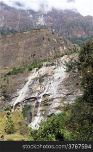 Waterfall and rock in mountain in Nepal