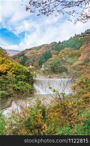Waterfall at Tsuchiyu Onsen in beautiful autumn (fallen leaves) at tohoku, Fukushima, Japan