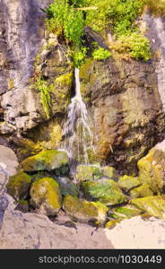 Waterfall by the side of Porthmeor Beach in St Ives Cornwall England