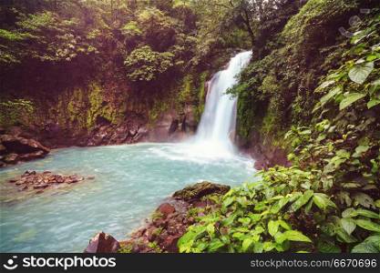 Waterfall in Costa Rica. Majestic waterfall in the rainforest jungle of Costa Rica. Tropical hike.