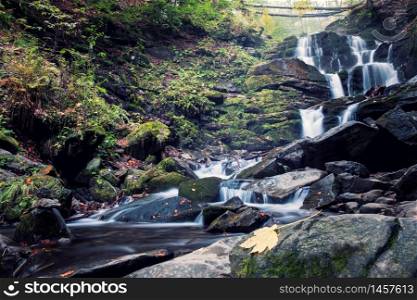 waterfall in deep forest. Cascad creek in mountains