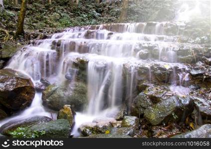 Waterfall in deep rain forest (Mae Kampong Waterfall in Chiang Mai Province, Thailand)