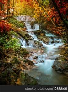 Waterfall in deep tropical jungle in autumn.