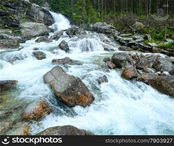 Waterfall in Great Cold Valley (Velka Studena dolina) summer view. High Tatras, Slovakia.