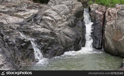 Waterfall in summer mountain