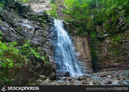 Waterfall in the Carpathian mountains. Nature of Ukraine.