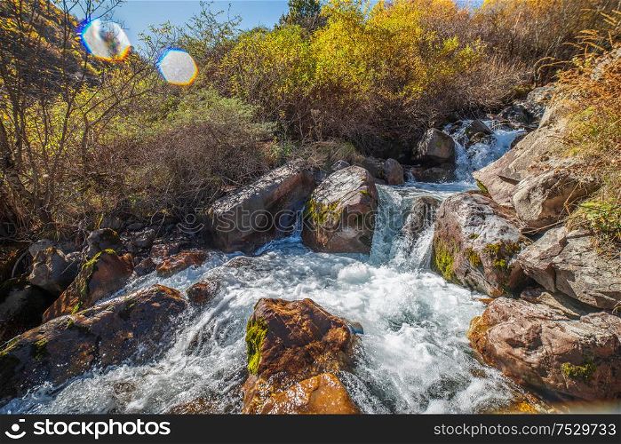 Waterfall in the mountains of the Caucasus. Autumn