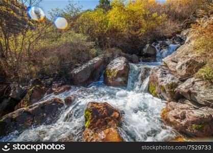 Waterfall in the mountains of the Caucasus. Autumn